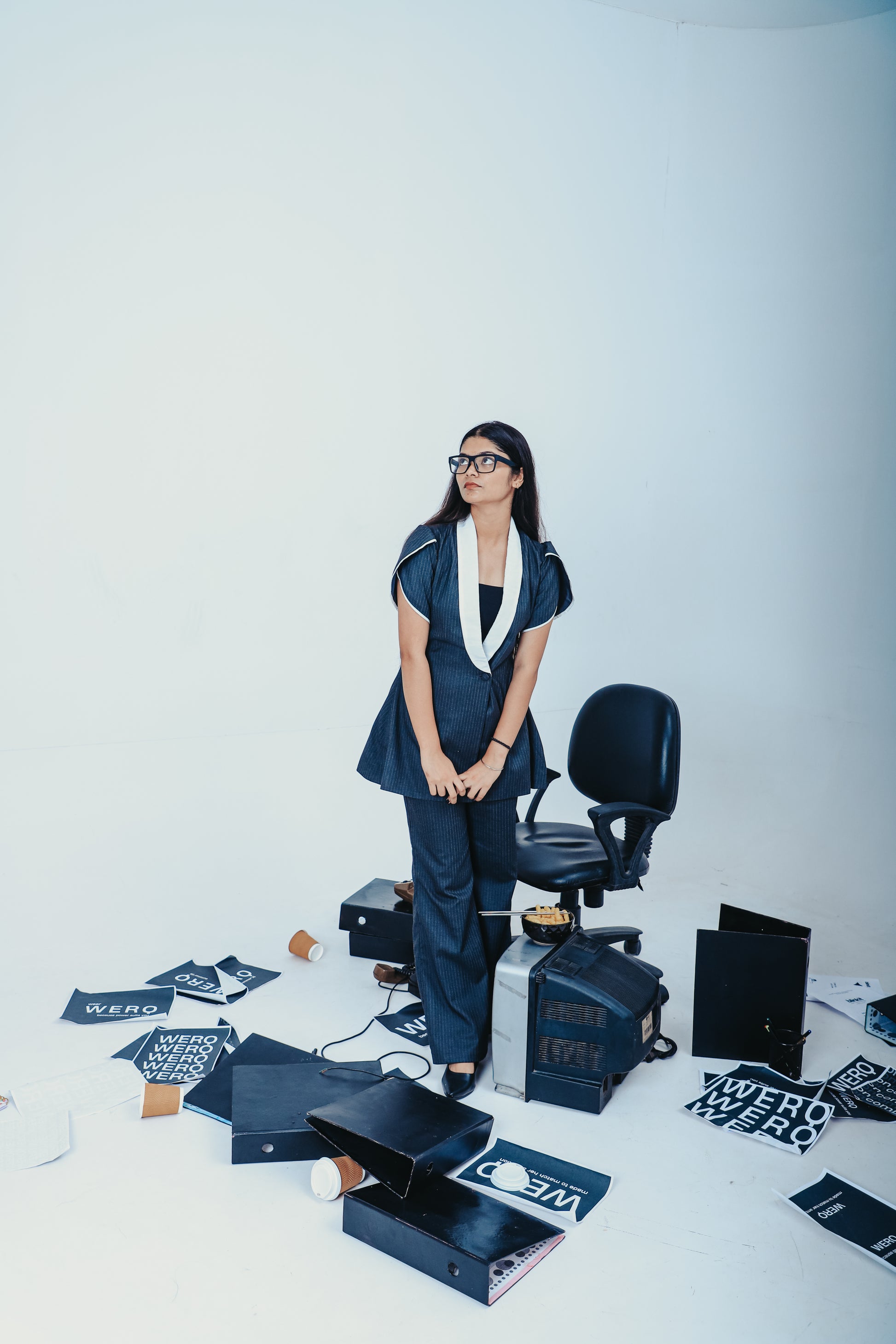 grey pinstripe pantsuit, feminine tailored suit India, WERQ formal women’s suit, soft structured grey blazer, professional grey co-ord for women, boot-cut trousers formalwear, fit and flare blazer suit with tulip sleeves, fitted blazer set India, sustaina