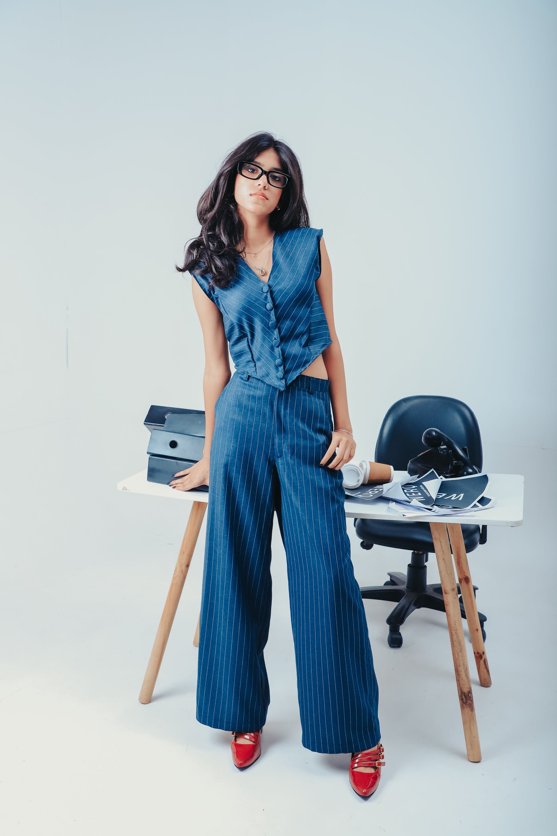 WERQ blue striped suit, pinstripe trouser suit, wide pants suit for women, formal two-piece blazer and pant set, modern Indian formalwear, fashion-forward officewear, India-based brand WERQ, high-end tailored co-ord, luxury blue work suit, empowering busi